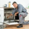 AppliancePro technician repairing a dishwasher in Dubai, providing expert dishwasher repair services for all major brands.